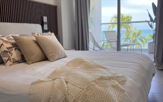 LIVE YOUR BEST LIFE AT THE PALMS 1 BED PLUS FLEX ROOM. OCEAN VIEWS
